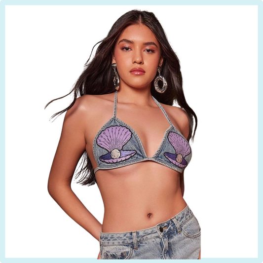 Forever21_Clam_seashell_Festival_summer_top_iheartjlove_marketplace_instagram.com/iheartjlove_shop_now_Crafted from non-stretch denim, this bralette features an allover acid wash, clamshell and pearl front patches, self-tie string closures, and a triangle silhouette. <p>- Matching bottoms available.&nbsp;</p>